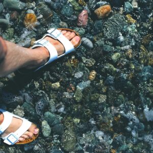 Person wearing premium leather sandals